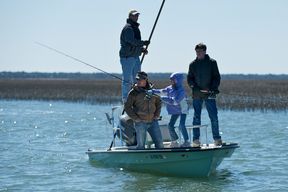Poling around the marsh for red drum