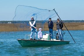 Capt. Legare shows how to cast a castnet